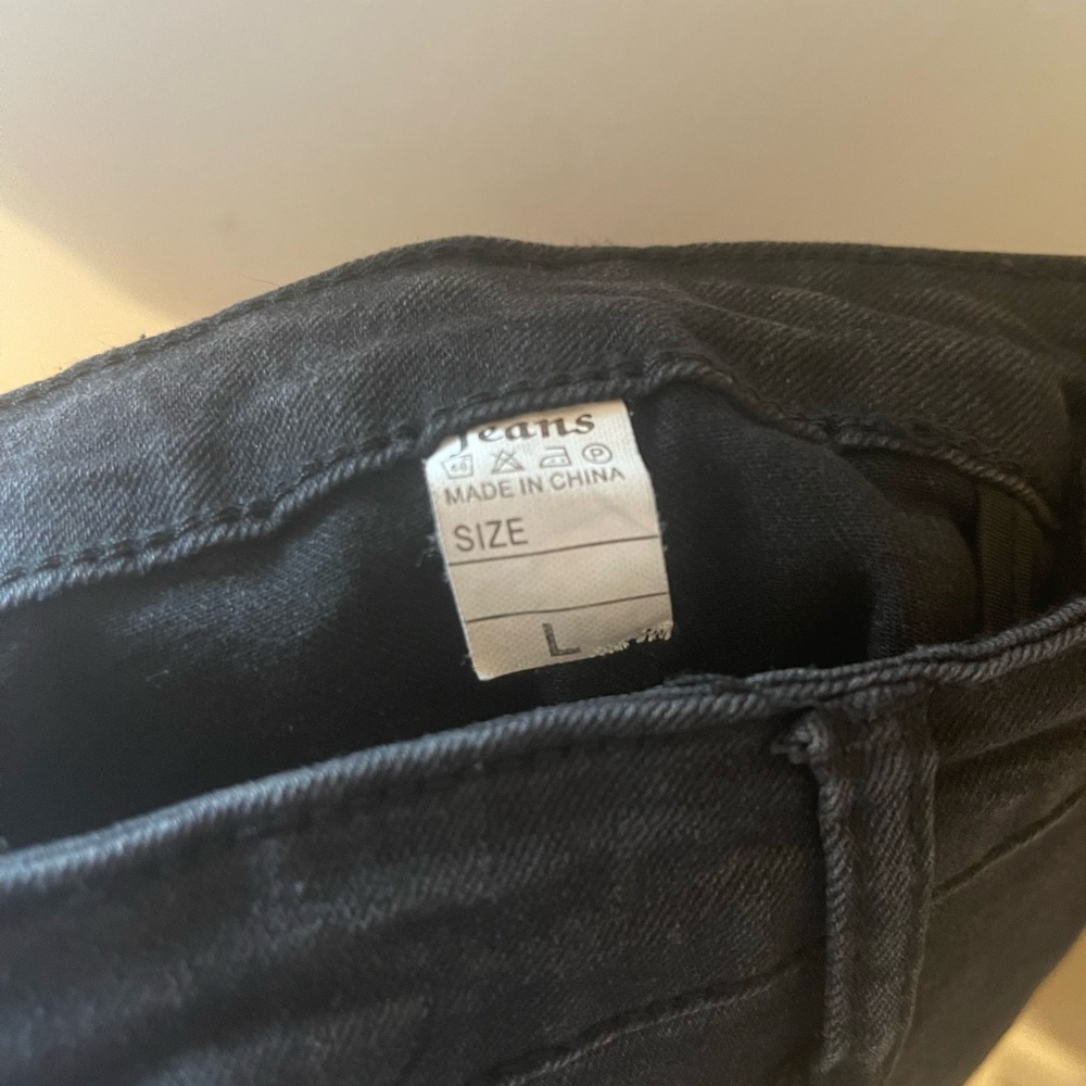 Black Flare Jeans with Distressed Knees